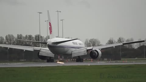 Landing of the Air China Boeing 777F at the rainy Amsterdam Airport, Netherlands.