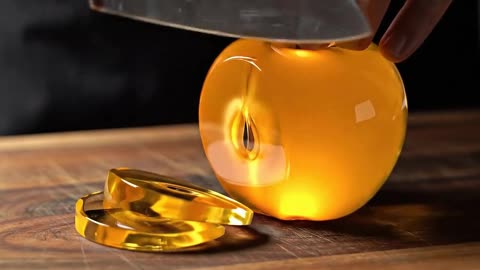 Cutting Glowing Golden Glass Fruit