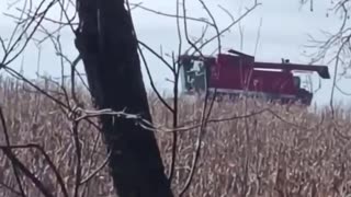 Ukrainian Artillery Firing with a Farmer Harvesting Wheat in the Background(In Ukraine, The Land Farms You)
