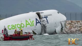 A cargo aircraft skids off a Hong Kong runway into the sea, killing 2 airport workers