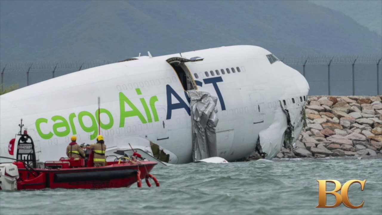 A cargo aircraft skids off a Hong Kong runway into the sea, killing 2 airport workers