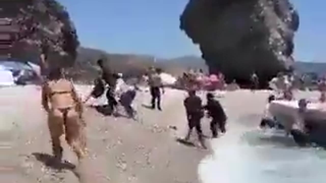 Fake asylum seekers invade topless beach in Spain.