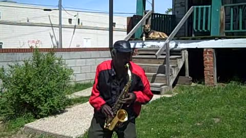 SAX PLAYER IN THE HOOD ON THE SHEA SHOW