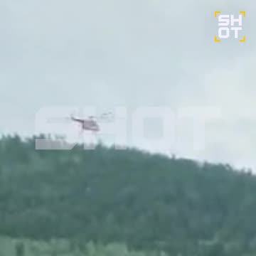 Search and Rescue Helicopter Hovers Over Regional Airliner Plane Crash in Russia's Amur Region