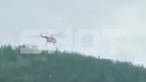 Search and Rescue Helicopter Hovers Over Regional Airliner Plane Crash in Russia's Amur Region
