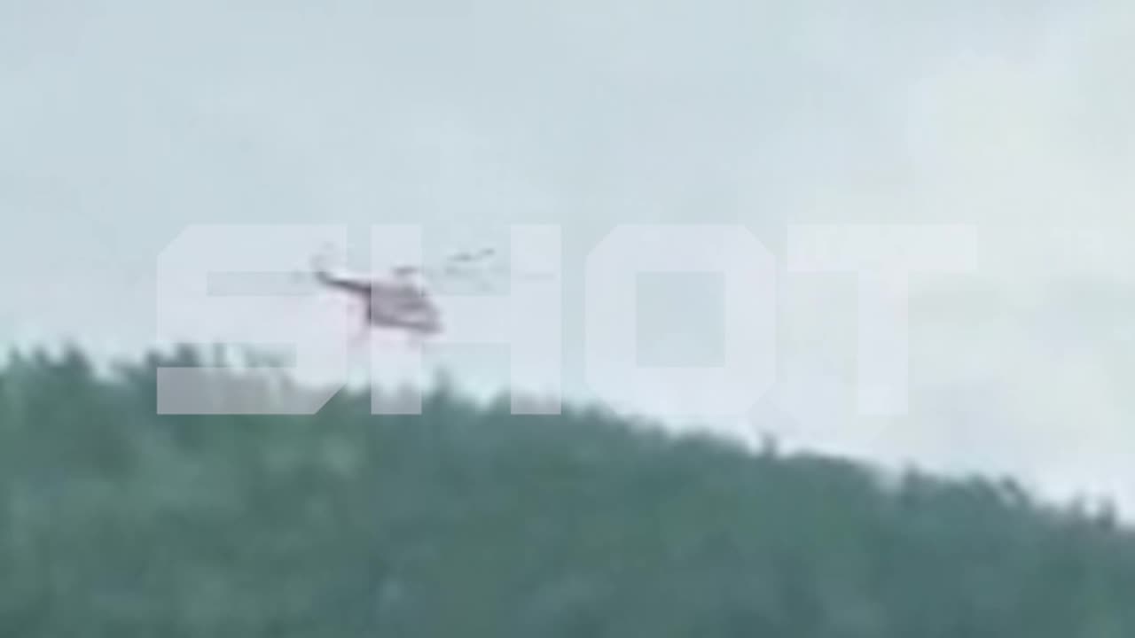 Search and Rescue Helicopter Hovers Over Regional Airliner Plane Crash in Russia's Amur Region