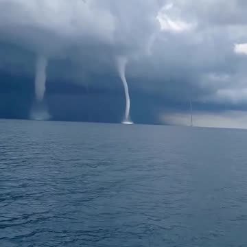 Incredible footage captures the formation of five waterspouts off Italy's coast.