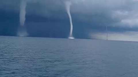 Incredible footage captures the formation of five waterspouts off Italy's coast.