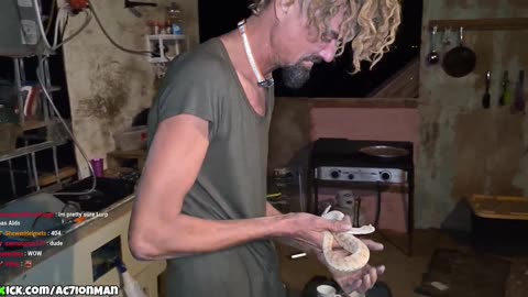 Man plays with snake on ac7s stream