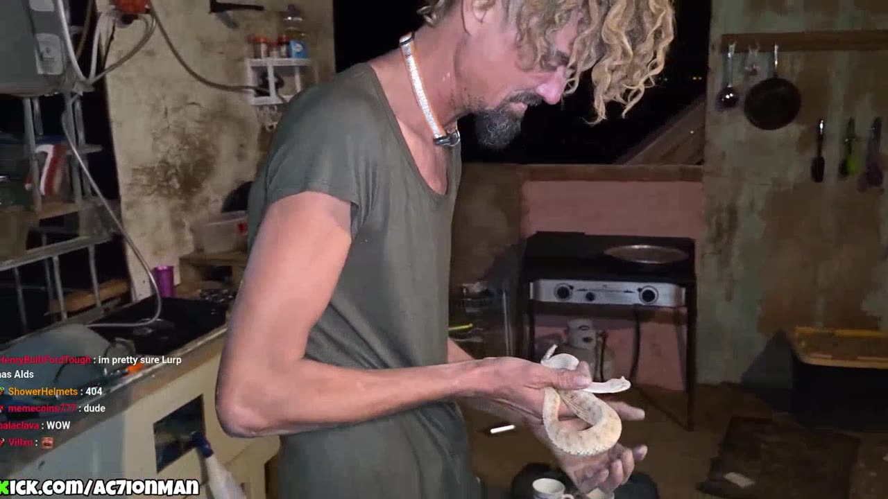 Man plays with snake on ac7s stream