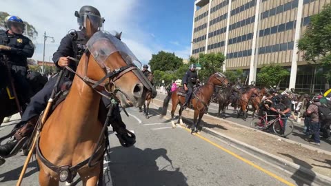 An unlawful assembly has been declared in Los Angeles and the LAPD mounted