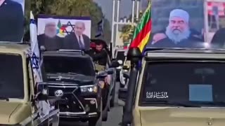 Syrian Druze march holding photos of Israel's Prime Minister Netanyahu in an act of gratitude