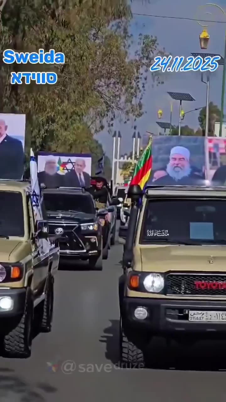 Syrian Druze march holding photos of Israels Prime Minister Netanyahu in an act of gratitude