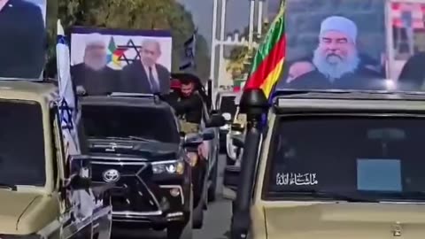 Syrian Druze march holding photos of Israel's Prime Minister Netanyahu in an act of gratitude