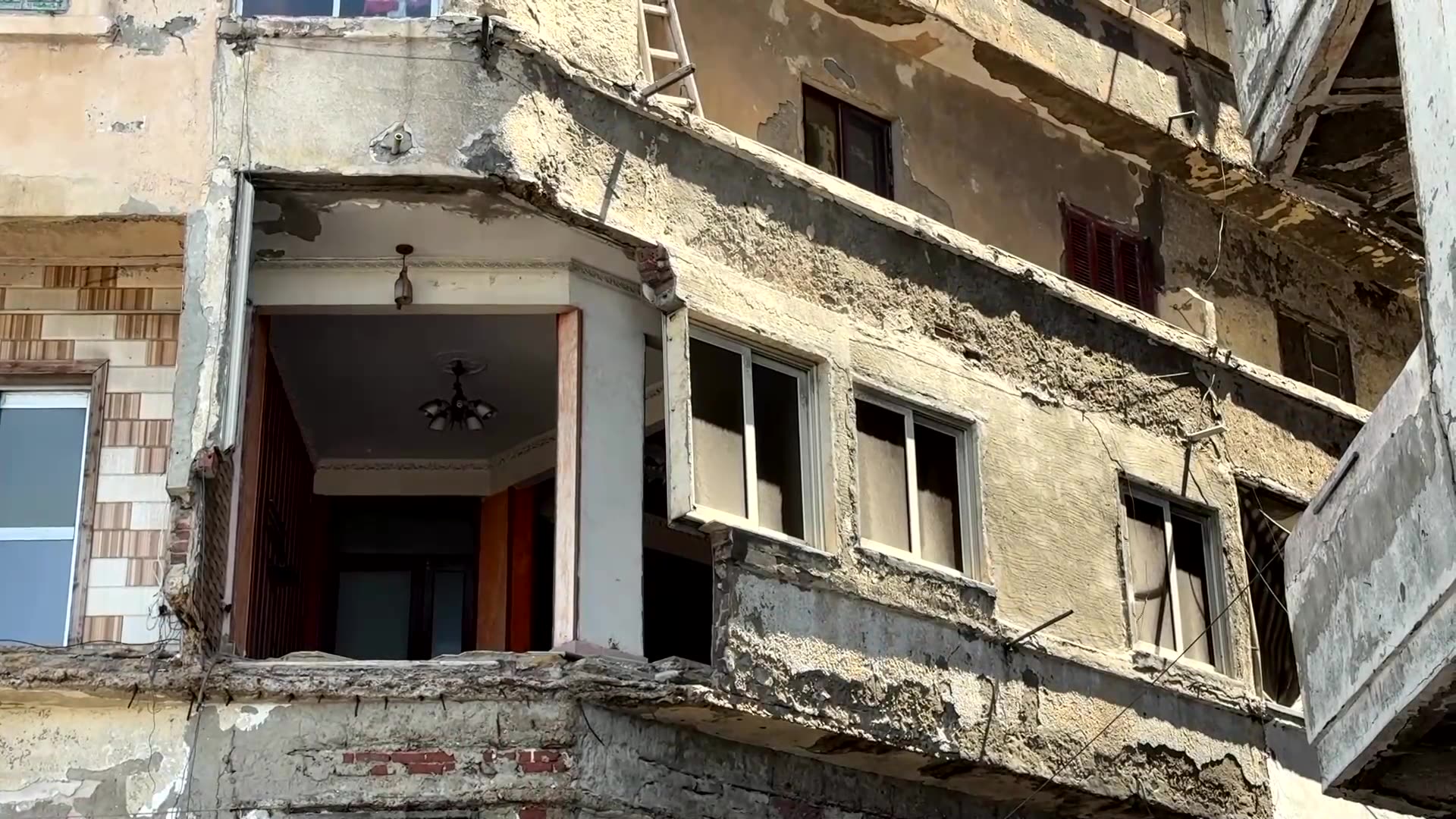 As seas rise around Alexandria, ancient city faces crumbling housing