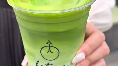 Making strawberry matcha drink