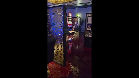 A woman is going viral for persistently gambling despite the casino being flooded.
