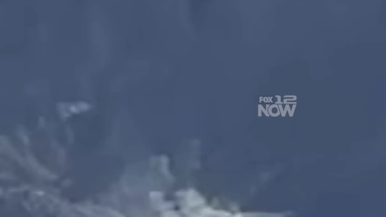 steam or smoke coming from the top of Mount Hood.