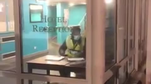 Homeless British couple sleeping on a mattress in migrant hotel carpark