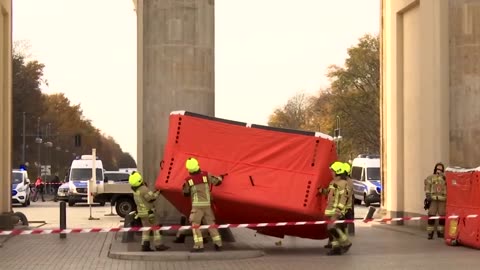 Pro-Palestinian protesters unfurl banner atop Berlin's Brandenburg Gate