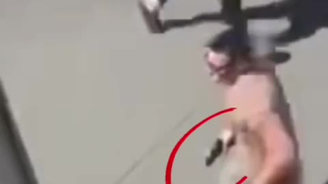 Charlie Kirk assassination - is this man running with a hand gun?