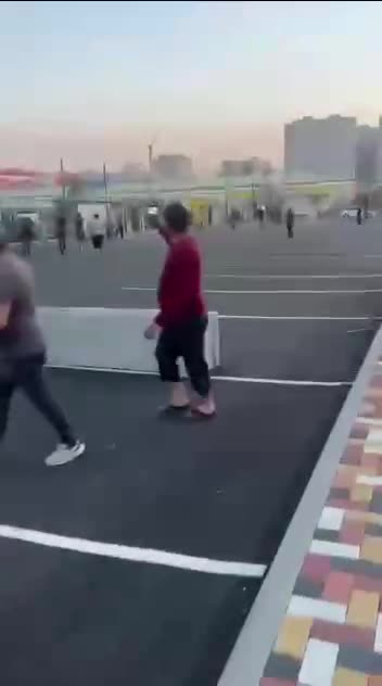 Dozens of People Come Out to Watch Ukrainian Attack Drones Smashing into Electronics Plant