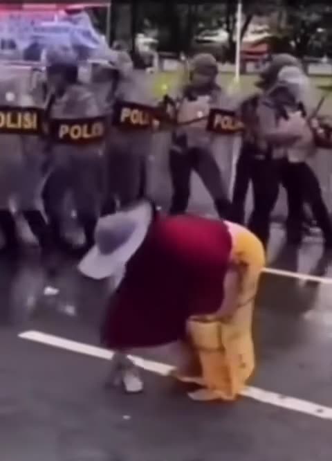 The Slipper Power! Grandma Scares Police During Riot