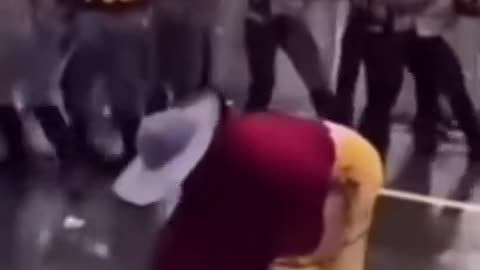 The Slipper Power! Grandma Scares Police During Riot