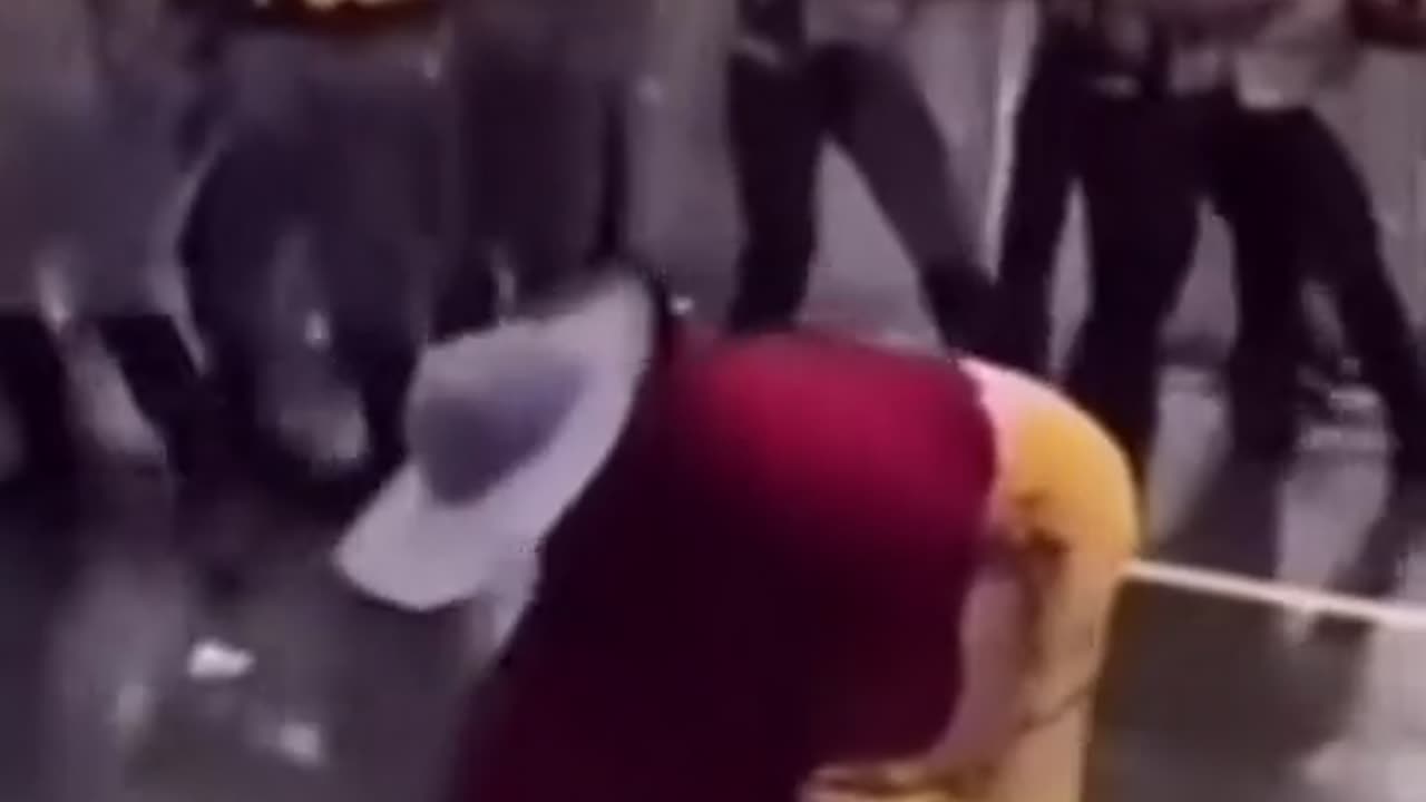 The Slipper Power! Grandma Scares Police During Riot