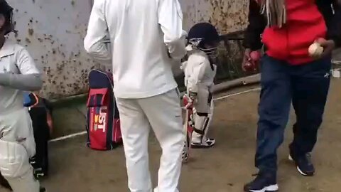3 years old boy playing cricket