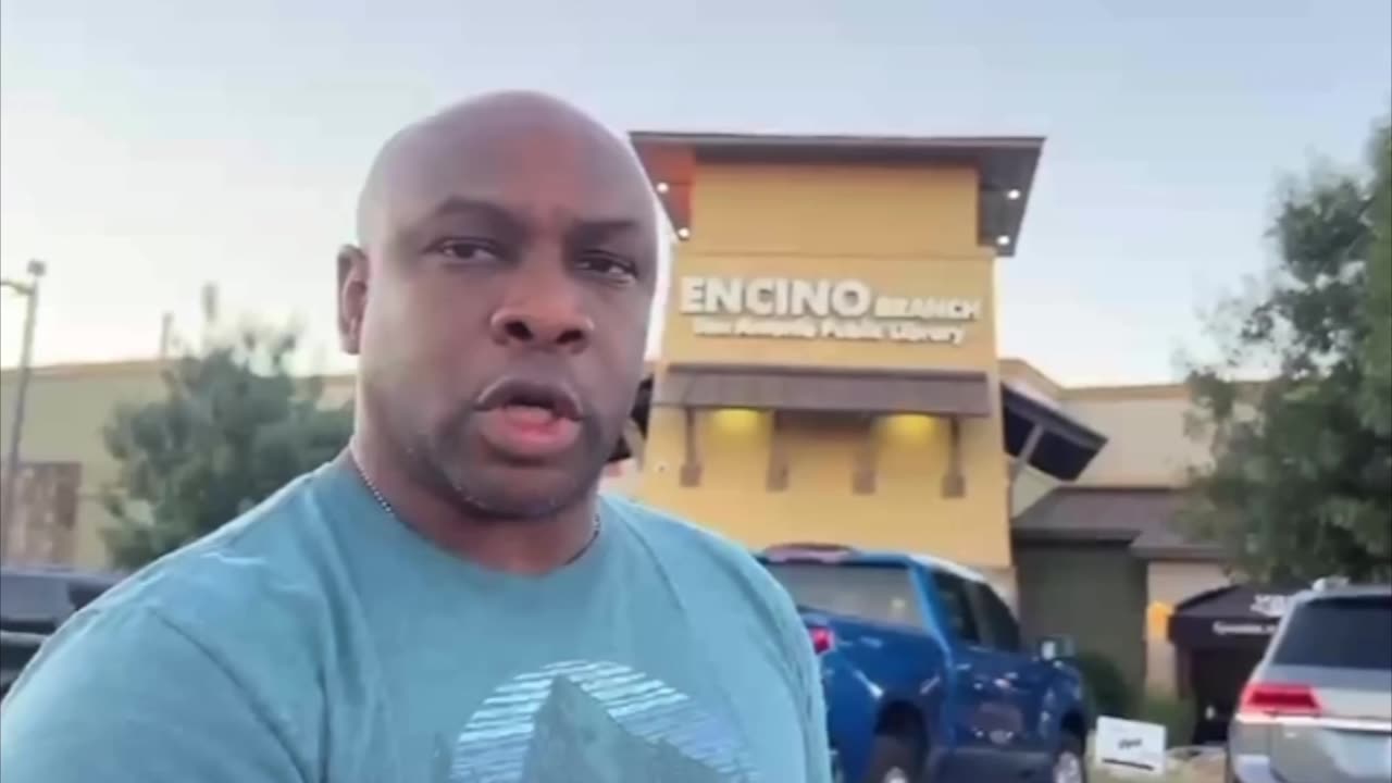 A low information black man has a problem with me video recording at a public library