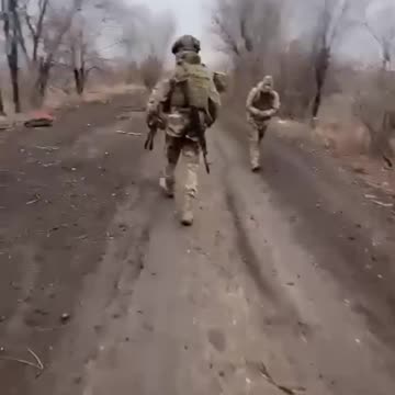 Apocalyptic Scenes of Russian Soldiers Clearing Road of KIA