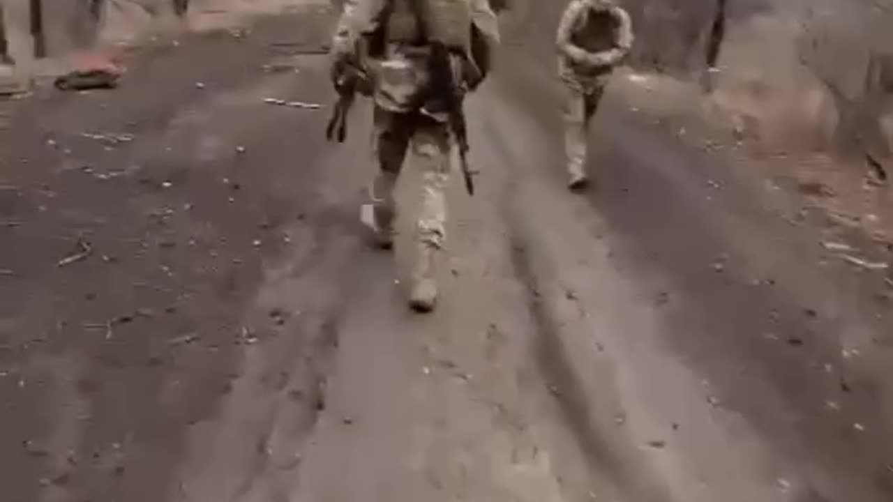 Apocalyptic Scenes of Russian Soldiers Clearing Road of KIA