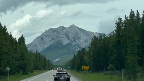 Scenic Drive Towards Majestic Mountain Range