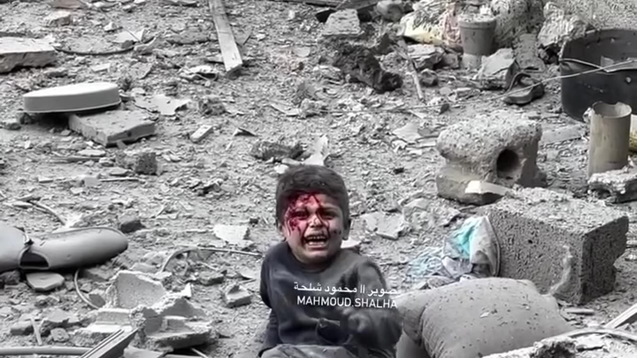 An injured child is located on the roof of a neighboring building