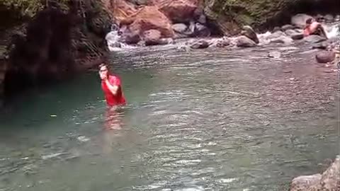 happy swimming with family in the river