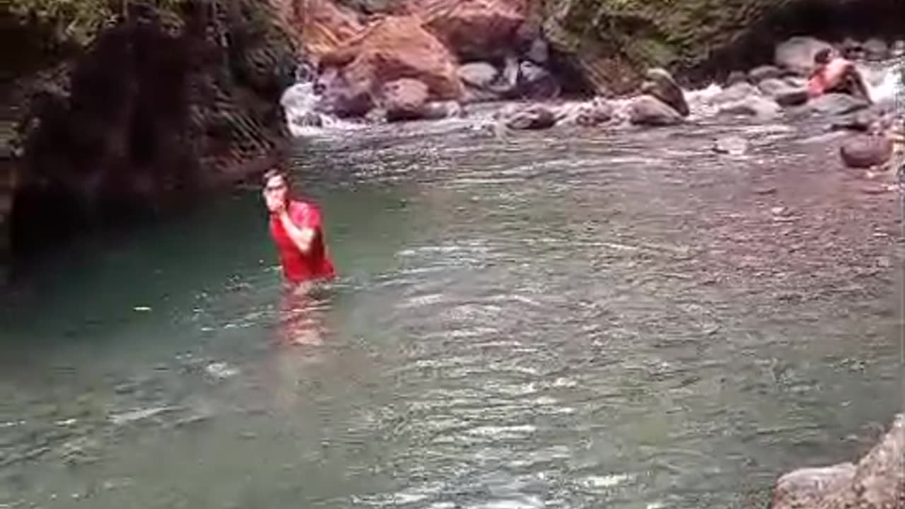 happy swimming with family in the river
