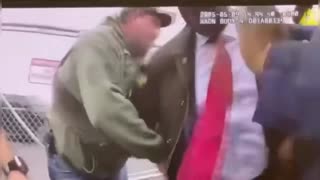 Fox News appears to confirm Rep. LaMonica McIver (in red) elbowing a DHS agent yesterday.
