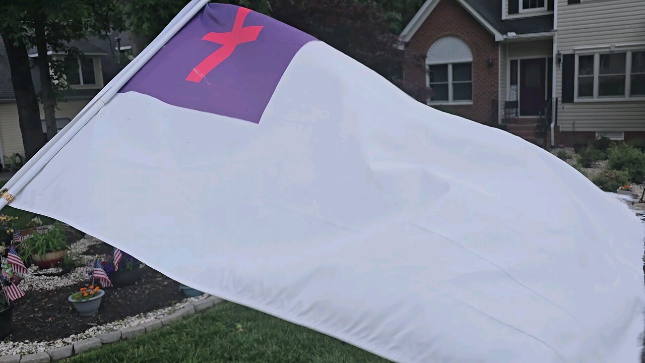 Christian Flag in front of luxury Home