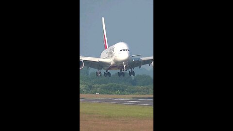 Fly Emirates landing at Heathrow Airport