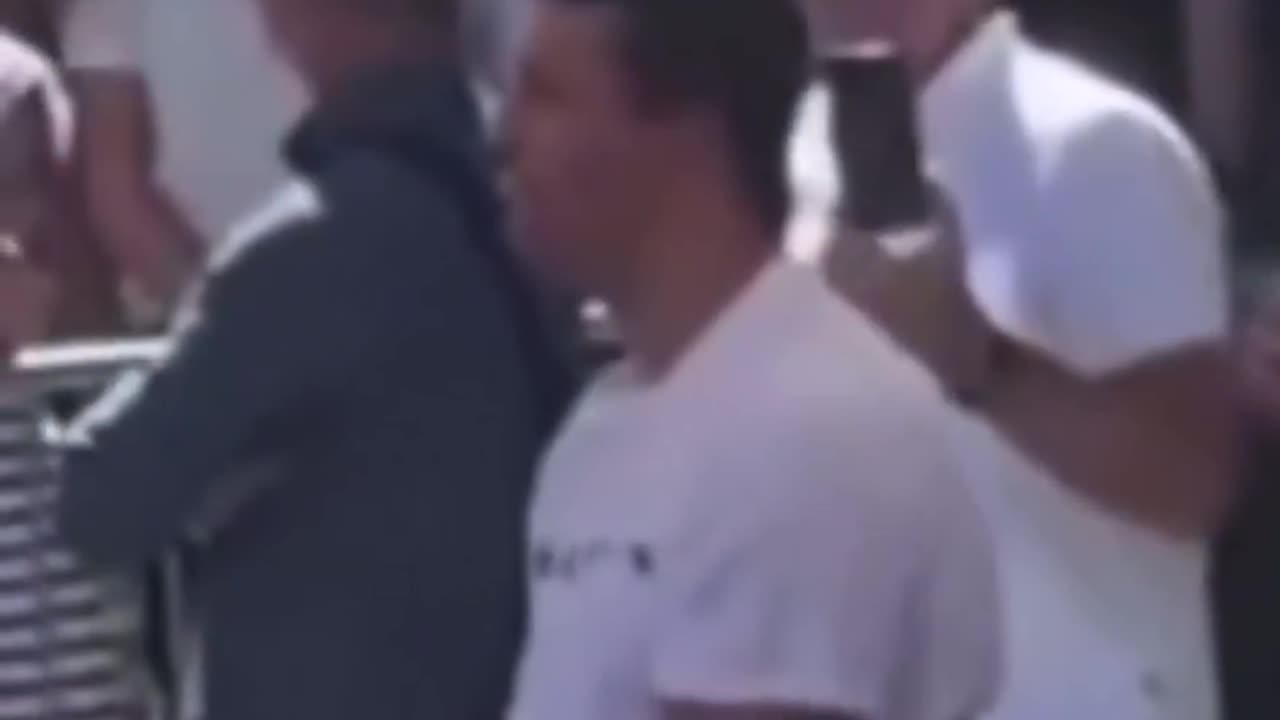 Who is the person behind Charlie Kirk and why is he making what appears to be a “signal”