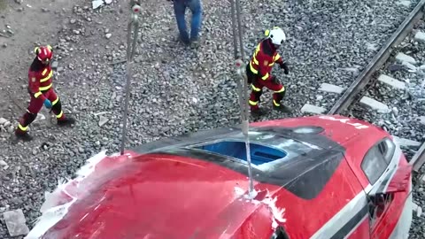 Spain's military emergency unit helps clear wreckage after crash