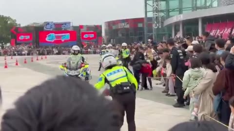 Police officer on a motorcycle collided with a group of children during a celebratory parade