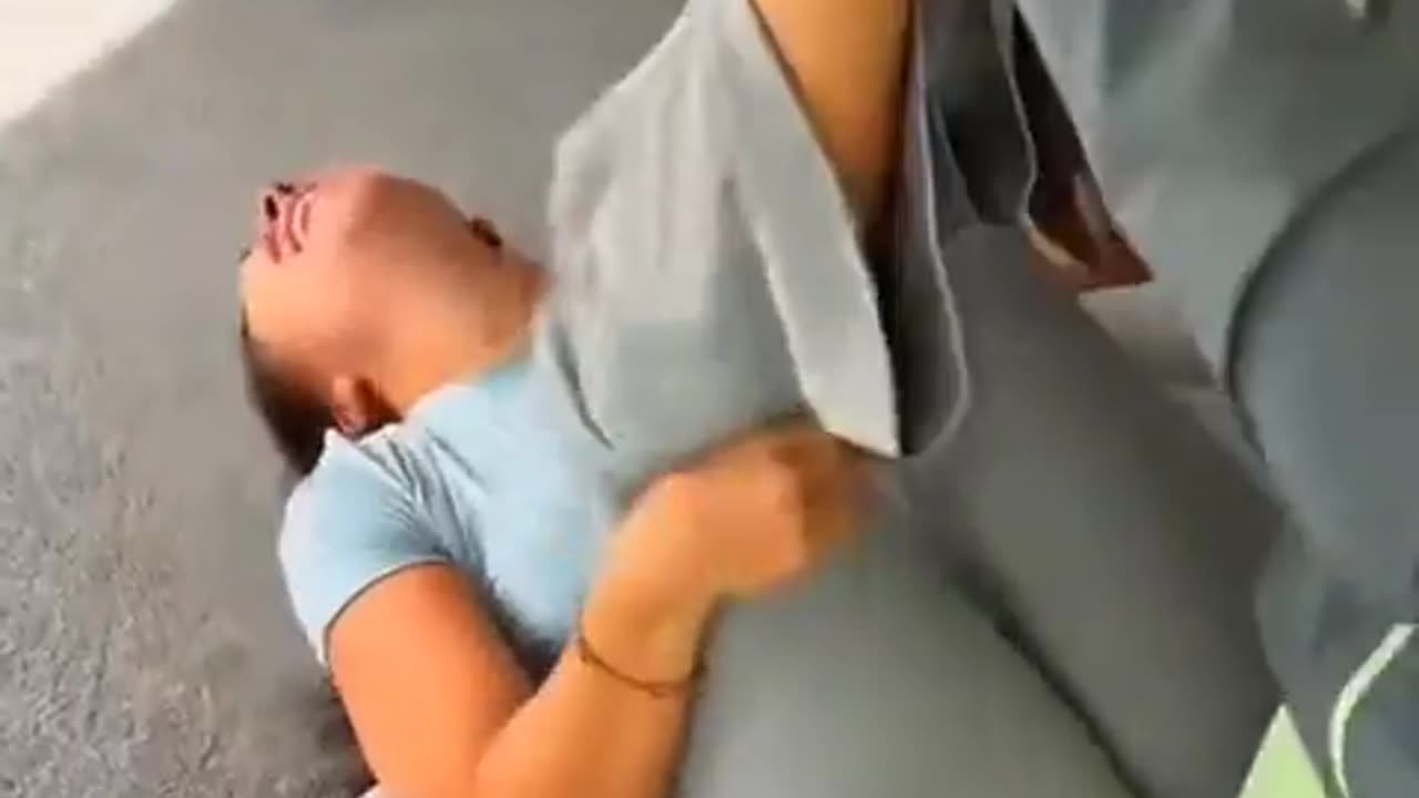 Boyfriend traps and tickles girlfriends feet with belt
