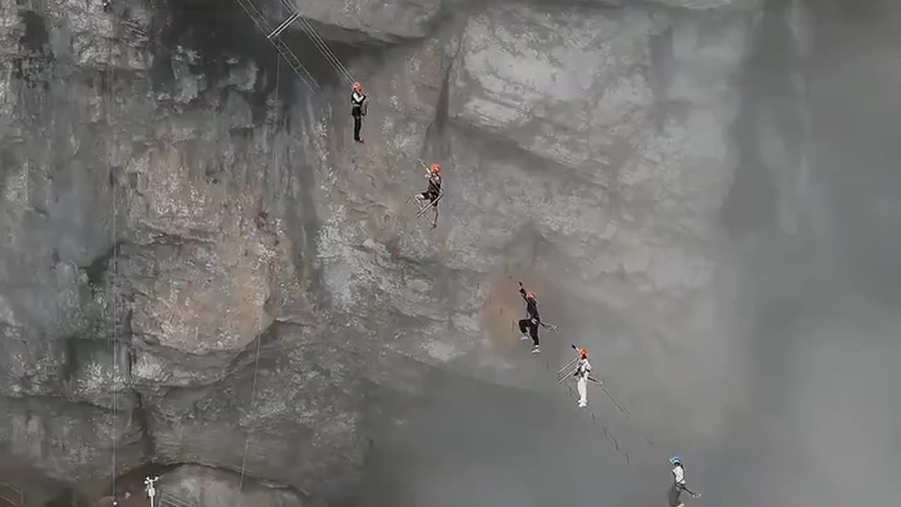 Whoa! Tourists climbing China's Huangshan Mountains with hanging ladders…