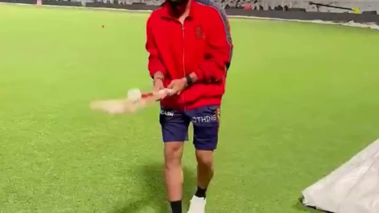 Virat juggling with bat