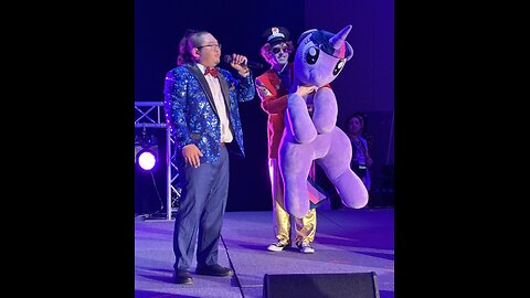 “What Should I do Twilight” - Tuo Li Live At Burning Mare featuring Liam Keel holding Twilight.