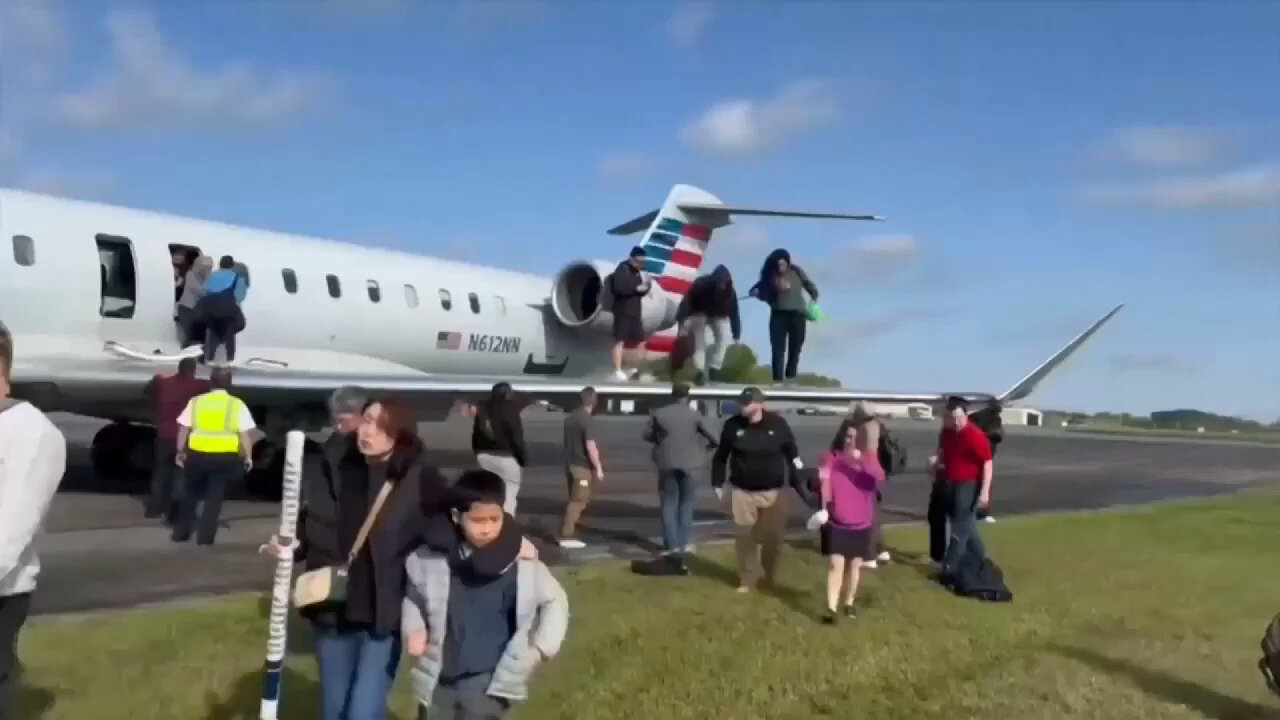 American Airlines Passengers Evacuate On Plane's Wing After Landing