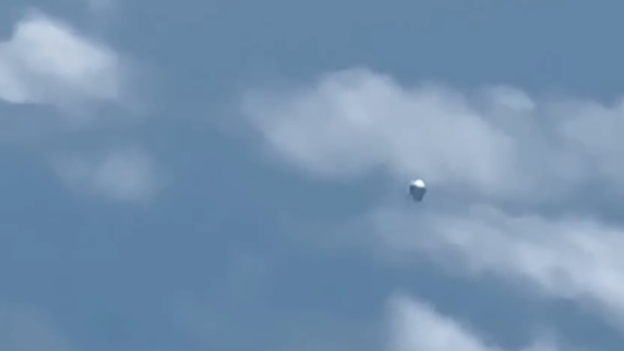 Silver UFO Videotaped from Airplane