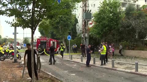 Rescuers assess residential damage in Tel Aviv following Iranian attack